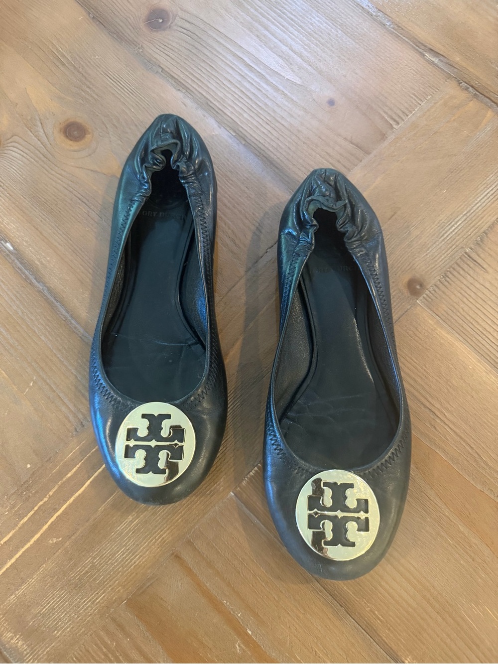 Tory Burch Black Leather Logo Ballet Flats with Gold Emblem